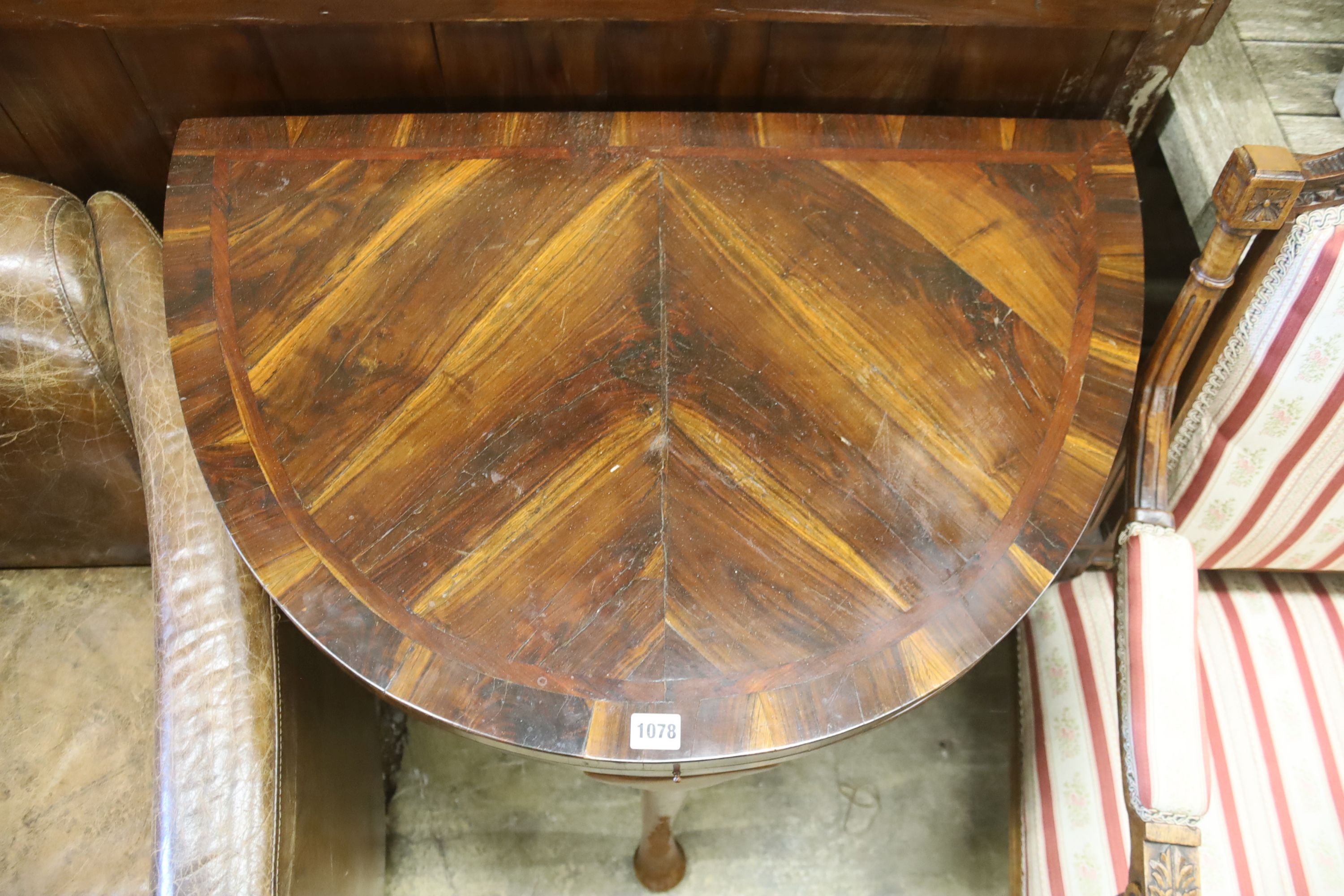 A 18th century Continental Goncalo Alves demi-lune card table with folding top, width 84cm, depth 56cm, height 76cm